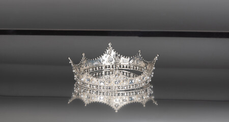 silver crowns with diamonds on a silver background
