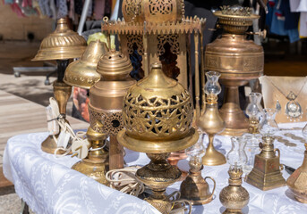 Fototapeta na wymiar Old copper lanterns on sold at the flea market