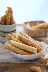 kue semprong or waffle egg roll, Indonesian traditional snack with unique shape like a layered pipe, crispy and crunchy.