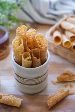 kue semprong or waffle egg roll, Indonesian traditional snack with unique shape like a layered pipe, crispy and crunchy.