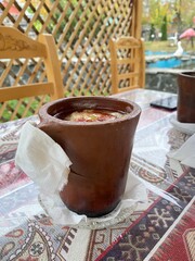 Azerbaijani Sheki piti soup prepared with mutton, tail fat, chickpeas, potato, onions, dried alycha and saffron and cooked in a clay pot - 591390180