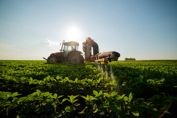 Spraying pesticides at soy bean fields