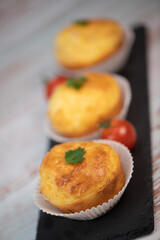 Savory muffin with ham and cheese on blue background, High quality photo