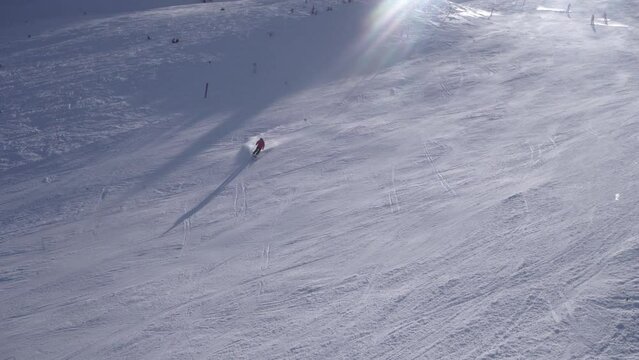 Multiple People Skiing At Alpine Resort During Winter Vacation - Top View
