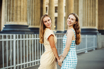 Lifestyle, people and friendship concept - two caucasian female friends expressing positive emotions to camera.