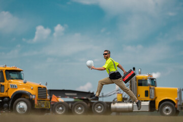 Portrait of american worker jump in construction helmet. Engineer builder foreman or repairman....