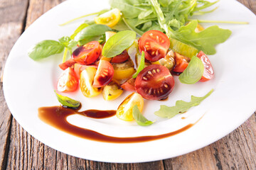 tomato salad- green, yellow and red tomato with lettuce and sauce