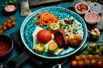 Grilled vegetables with onions and pita bread. Barbecue menu. Free space for text. Close up.