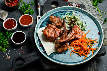 Grilled veal entrecote with onions and pita bread. Barbecue menu. Free space for text. Close up.