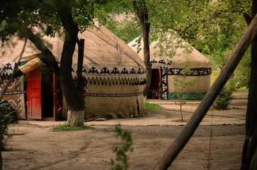 Yurts in an apricot orchard at a campsite in the Kyrgyz village of Ozgrush.