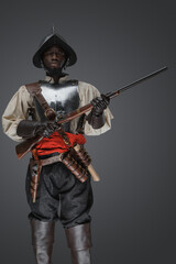 Shot of isolated on grey background soldier from 18th century with steel armor.