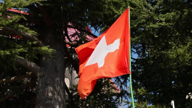 Switzerland flag, the flag develops in the wind