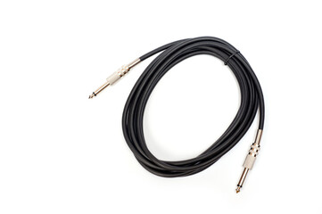 Fototapeta premium Long black jack cord for electric guitar, filmed on a white background.