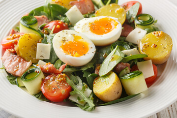 Homemade salad with vegetables, bacon, cheese and soft-boiled eggs seasoned with vinaigrette sauce...