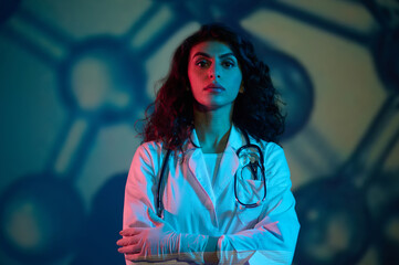 Cute brunette female doctor looking confident