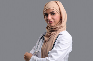 Fototapeta premium Young muslim woman in hijab looking contented and happy