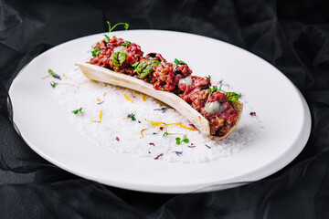 Exquisite serving beef tartare on plate