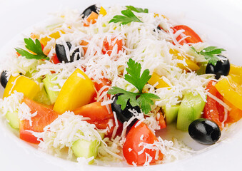 Fresh vegetable greek salad on white