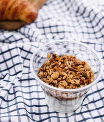 Delicious breakfast with granola and croissant