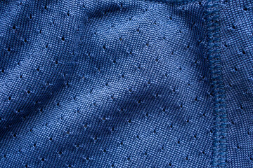 Blue sports clothing fabric football shirt jersey texture with stitches
