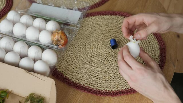 Add flower and onion skin on egg for Easter coloring.