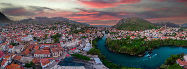 Aerial view of city of Mostar in Bosnia and Herzegovina and it's landmarks (Neretva river, Old...