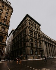 Vertical shot of a cityscape featuring metropolitan buildings on a gloomy winter day