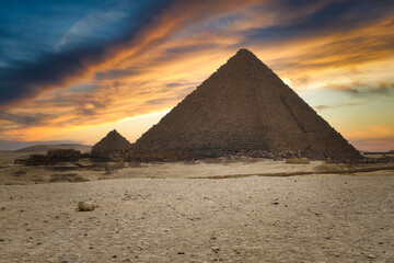 Beautiful sunset over the pyramid of Menkaure in Giza, Egypt