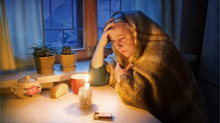 Woman with candles. Power outage in Kyiv