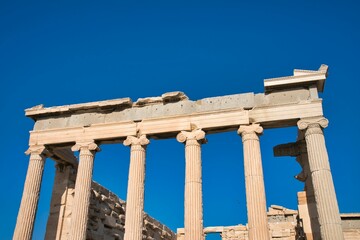 Fototapeta premium Low angle shot of the Parthenon against a blue sky in Athens, Greece on a sunny day
