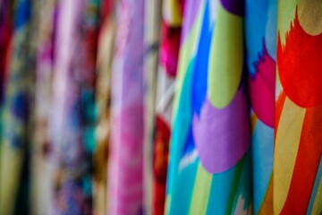 Closeup shot of colorful clothing in a store on a blurred background