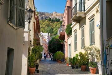 Scenic view of a narrow alley in Athens, Greece, surrounded by residential buildings