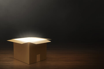 Mystery cardboard box on dark background 3d illustration - 591439159