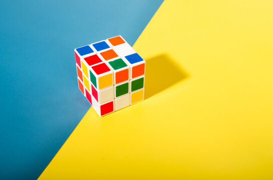 Thailand,Bangkok - April 11, 2023 Rubik's cube on a white background. Rubik's Cube on colored paper background Rubik's Cube invented by Hungarian architect Erno Rubik in 1974.