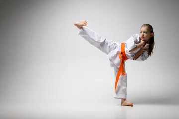 Fotobehang Teaching children self-defense in karate. © Andrii Zastrozhnov