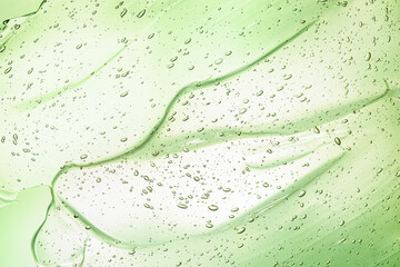 background-texture of aloe gel light green color with bubbles close-up