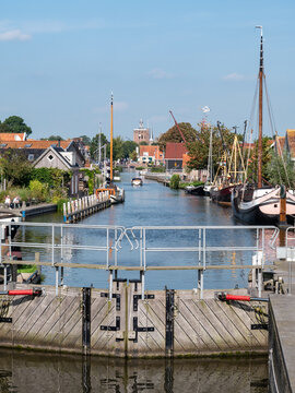 Diepe Dolte canal and church tower from lock in Workum, Friesland, Netherlands