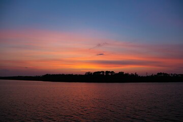 Fototapeta premium Landscape of the sea during a breathtaking sunset in the evening