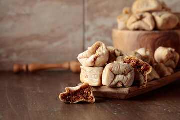 Dried figs in a wooden dish.
