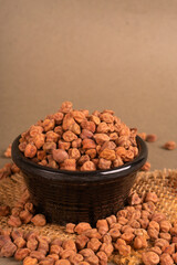Black Chickpeas or Kala Chana with chana dal pulse isolated on wooden Background.