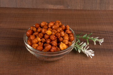 Black Chickpeas or Kala Chana with chana dal pulse isolated on wooden Background.