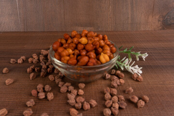 Black Chickpeas or Kala Chana with chana dal pulse isolated on wooden Background.