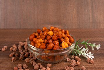 Black Chickpeas or Kala Chana with chana dal pulse isolated on wooden Background.