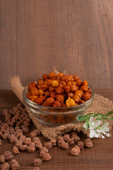 Black Chickpeas or Kala Chana with chana dal pulse isolated on wooden Background.