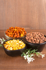Black Chickpeas or Kala Chana with chana dal pulse isolated on wooden Background.