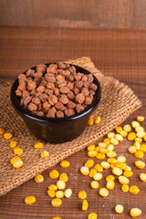 Black Chickpeas or Kala Chana with chana dal pulse isolated on wooden Background.