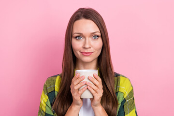 Photo of pleasant gorgeous nice woman with long hairstyle wear checkered shirt hold cup of coffee isolated on pink color background