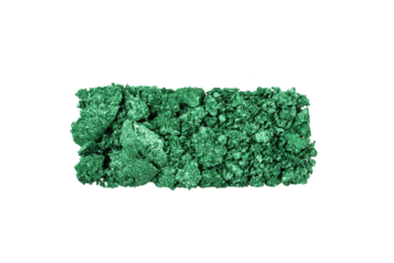 Green eye shadow swatch isolated on transparent background. Crushed shimmering green eye shadow texture.