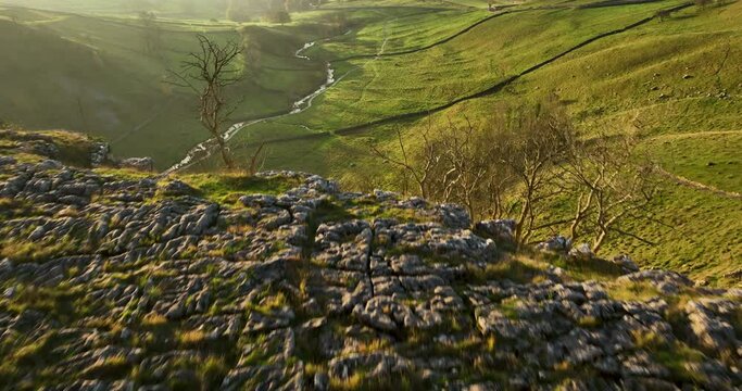 Flying over Malham Cove at sunrise