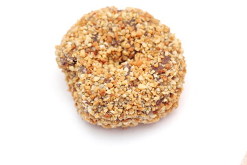 Close up of a chocolate donut isolated on a white background.